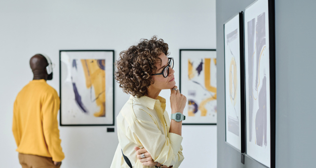 people looking at an art exhibit